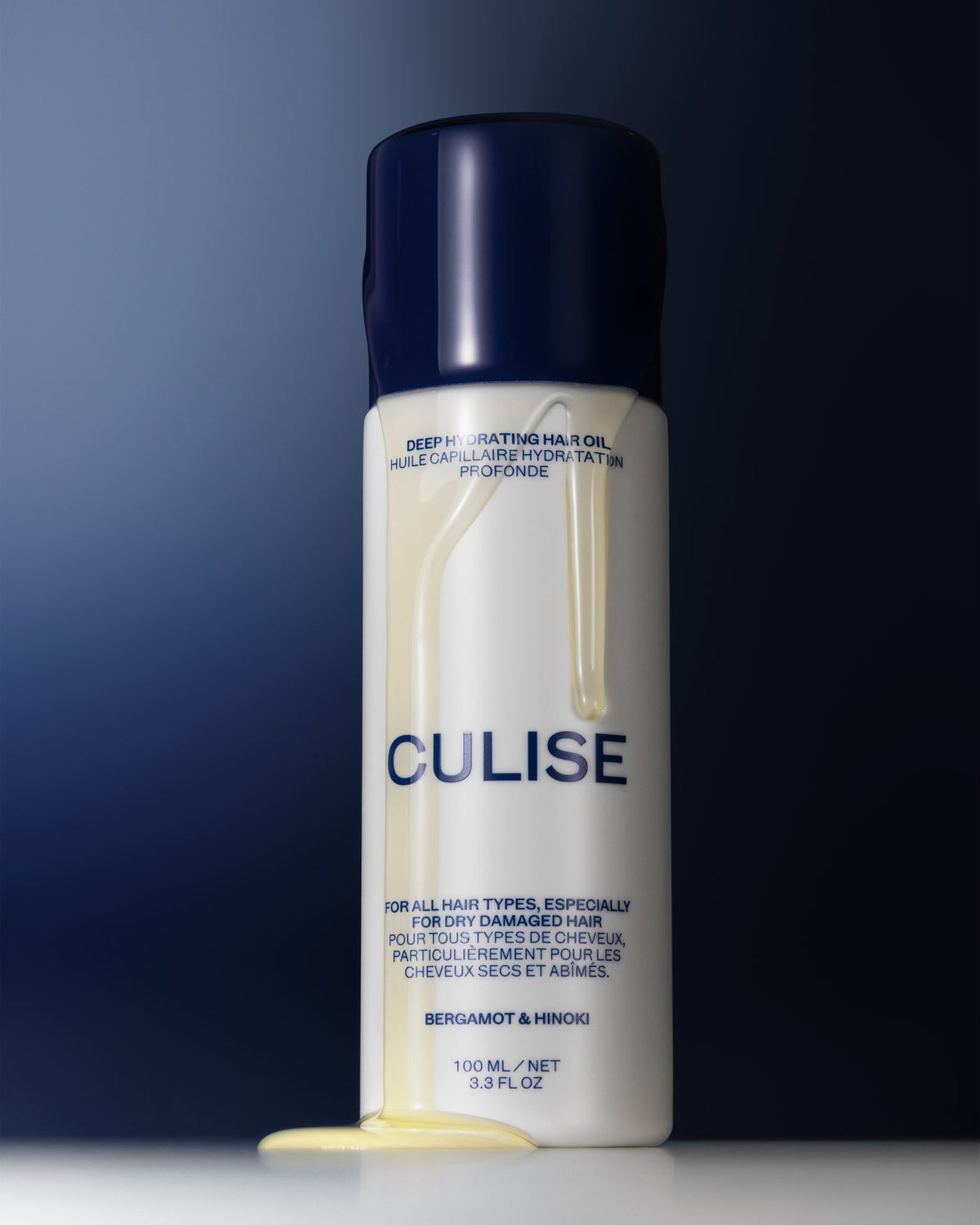 CULISE Deep Hydrating Hair Oil with oil running down the bottle
