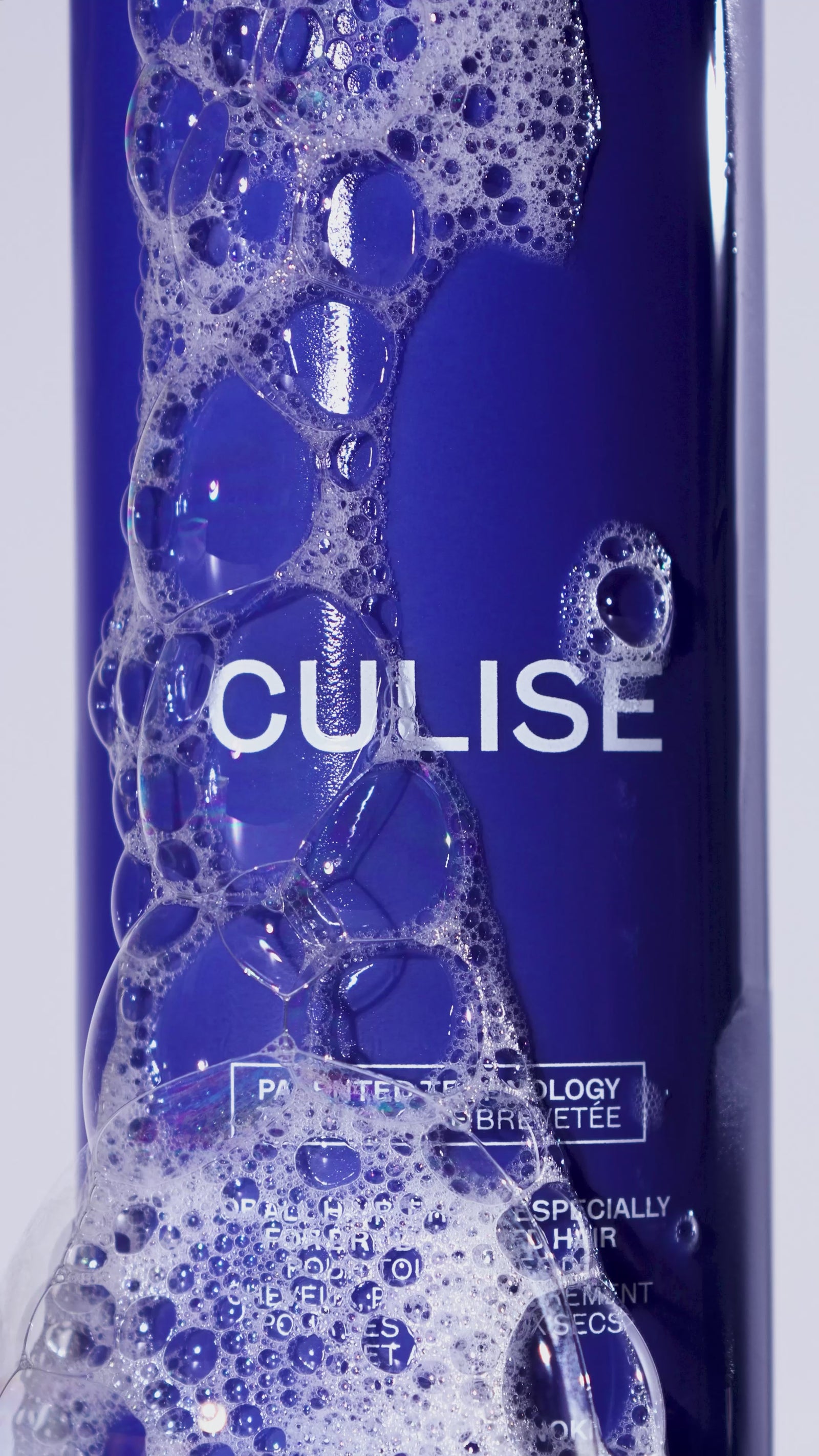 CULISE shampoo bottle in foam and bubbles